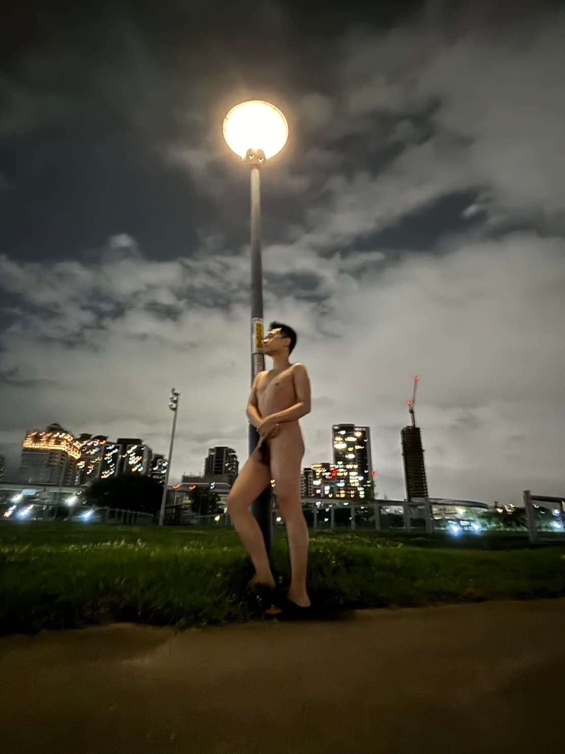 Nude Vigil Under Streetlight